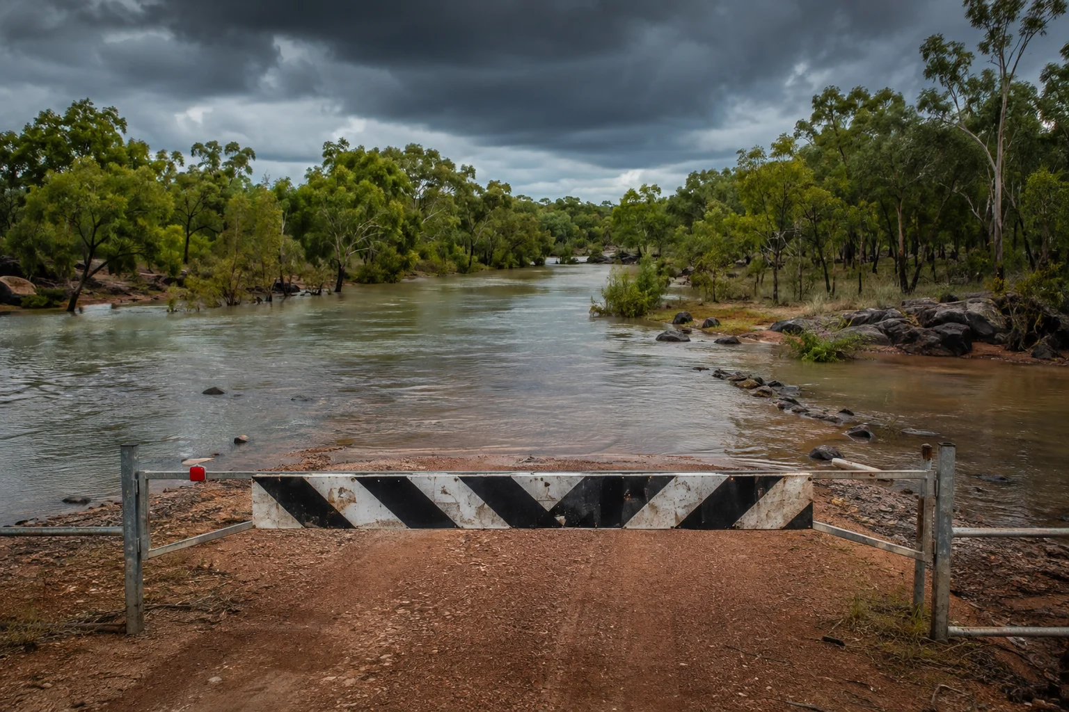 Outback road cut off by wet-season flooding