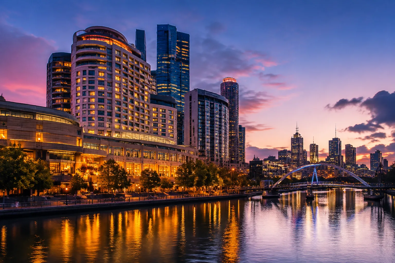 Riverside casino resort towers on the Yarra River at dusk