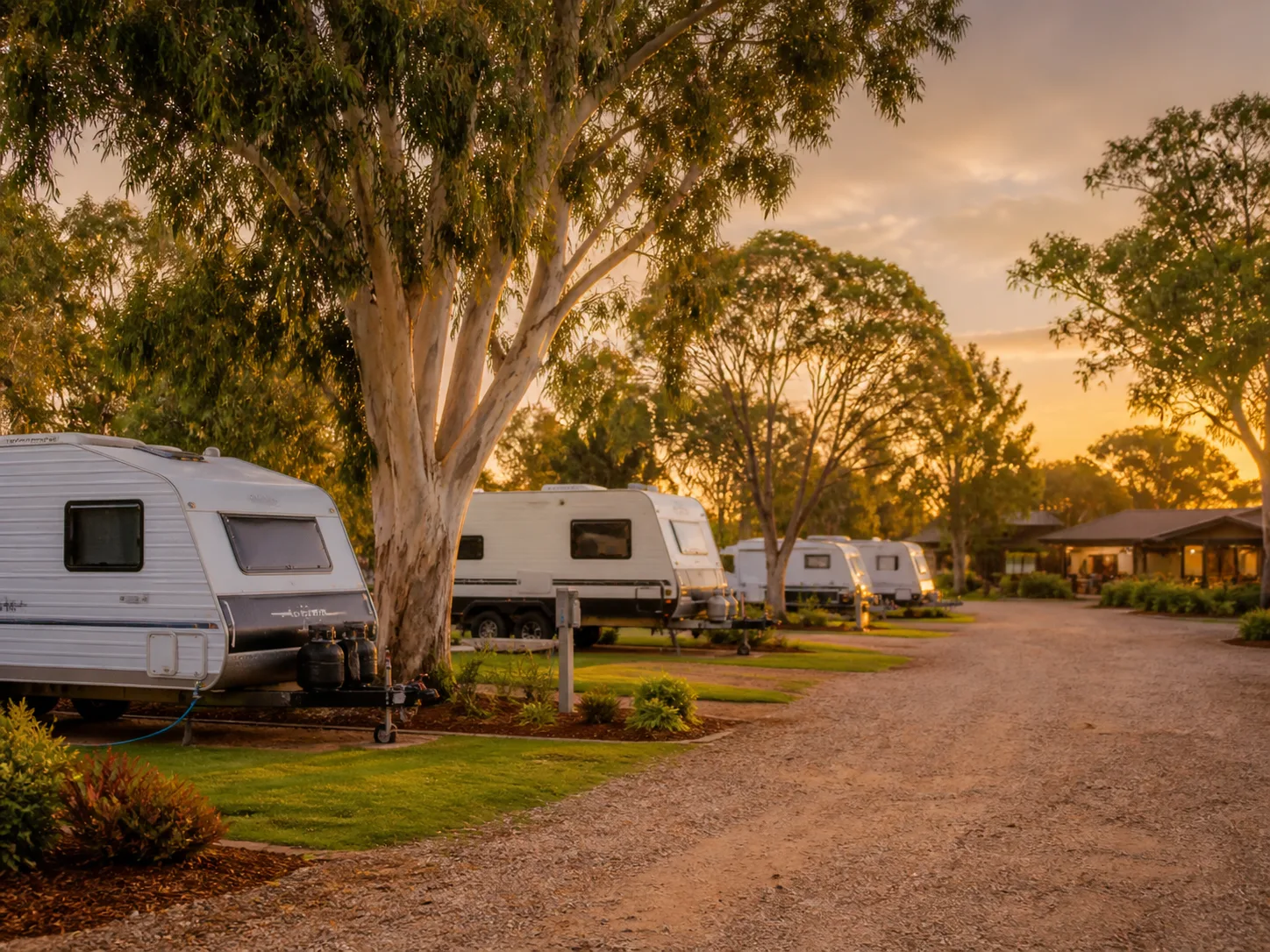 Tidy Australian caravan park with powered sites in evening light